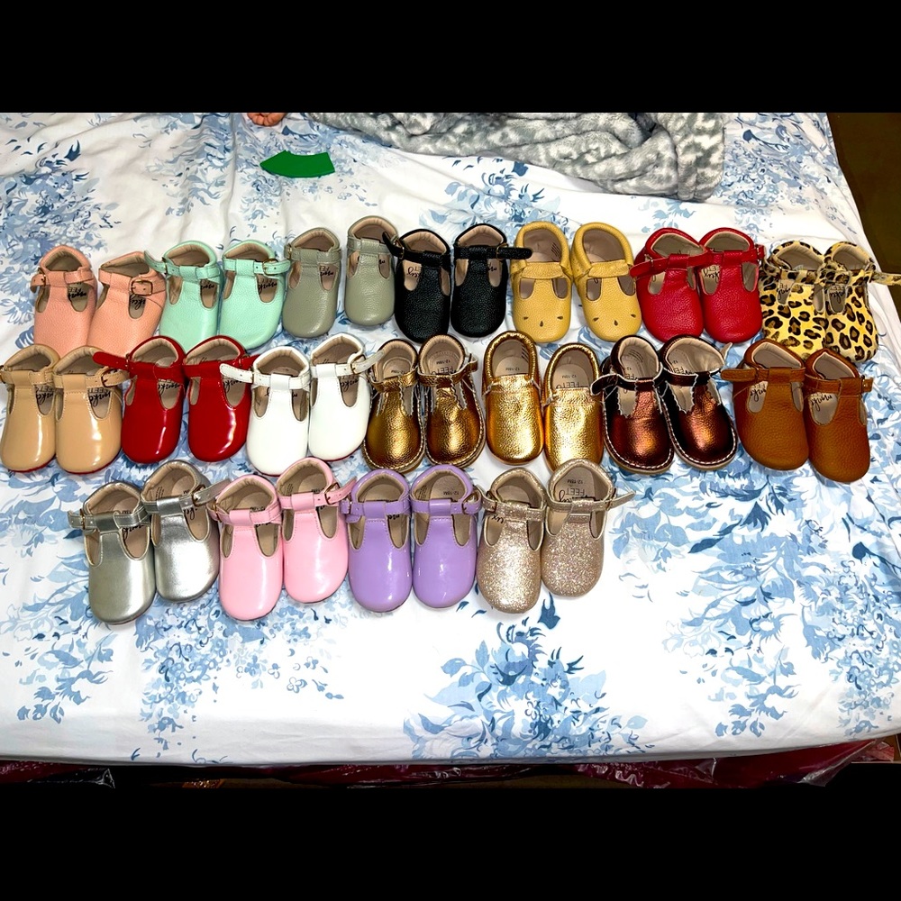 Selling monkey feet shoes for baby girl.